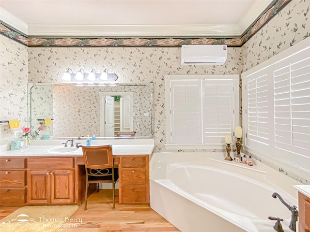 3226 County Road 360, Merkel, TX 79536 - bathroom with wallpapered walls, a wall mounted air conditioner, vanity, a bath, and wood finished floors