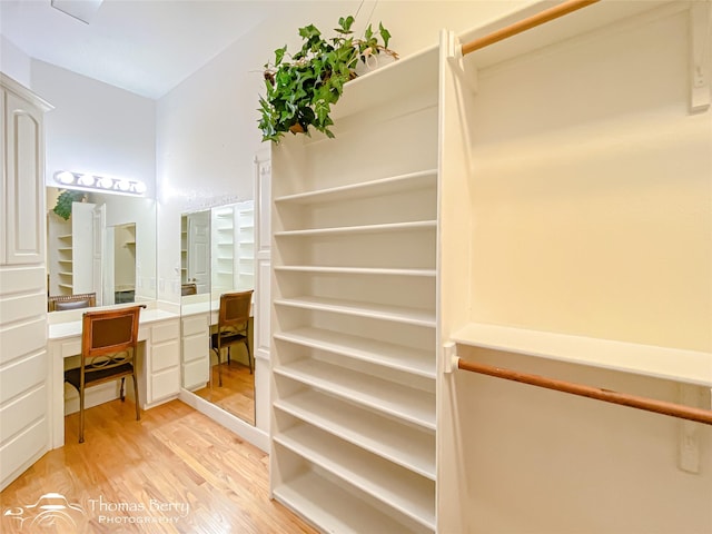 3226 County Road 360, Merkel, TX 79536 - walk in closet with light wood finished floors and built in study area