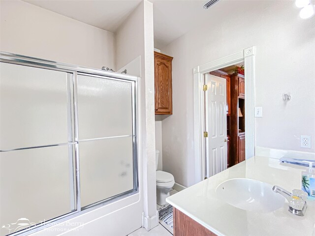 3226 County Road 360, Merkel, TX 79536 - full bath featuring toilet, vanity, and shower / bath combination with glass door