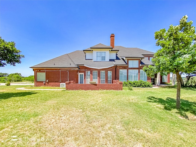 3226 County Road 360, Merkel, TX 79536 - rear view of property with a chimney, a yard, brick siding, and roof with shingles