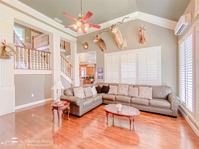 3226 County Road 360, Merkel, TX 79536 - living area with an AC wall unit, stairway, ceiling fan, wood finished floors, and baseboards