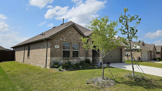 1416 Blossom Court Dr, Princeton, TX 75407 - view of front of house with concrete driveway, an attached garage, stone siding, and brick siding