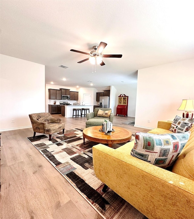 1416 Blossom Court Dr, Princeton, TX 75407 - living room featuring a ceiling fan, light wood-style flooring, baseboards, and recessed lighting