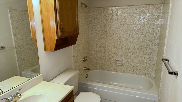 918 Maydelle Ln, Garland, TX 75042 - bathroom with washtub / shower combination, toilet, and vanity