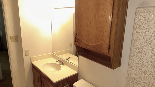 918 Maydelle Ln, Garland, TX 75042 - half bathroom with vanity and toilet