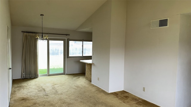 918 Maydelle Ln, Garland, TX 75042 - carpeted empty room featuring a chandelier and vaulted ceiling
