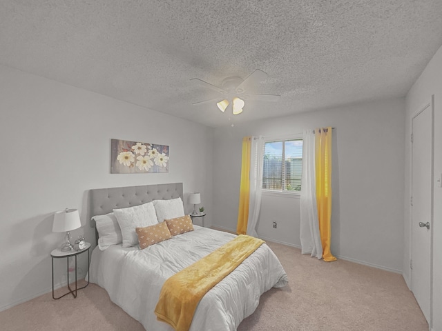 1215 Keechi St, Weatherford, TX 76086 - bedroom with light colored carpet, a textured ceiling, a ceiling fan, and baseboards