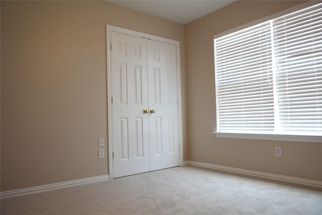 8300 Charleston St, Irving, TX 75063 - unfurnished bedroom featuring carpet flooring, a closet, and baseboards