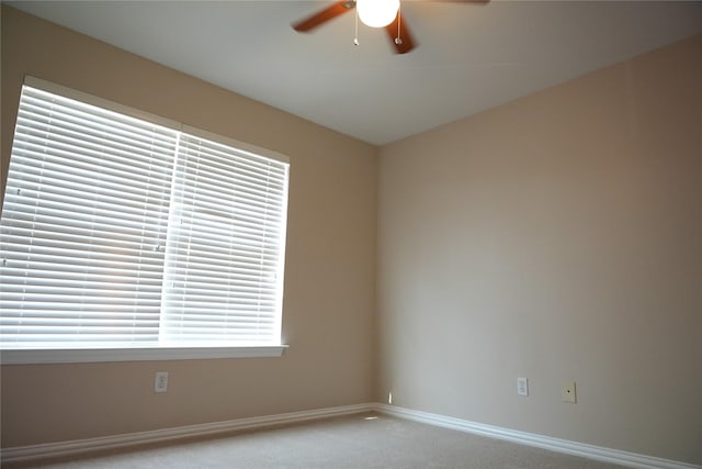 8300 Charleston St, Irving, TX 75063 - empty room with a ceiling fan, carpet, and baseboards