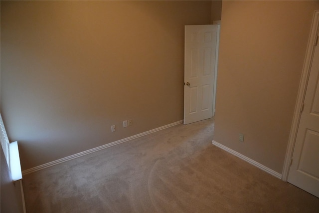 8300 Charleston St, Irving, TX 75063 - unfurnished bedroom featuring light carpet and baseboards