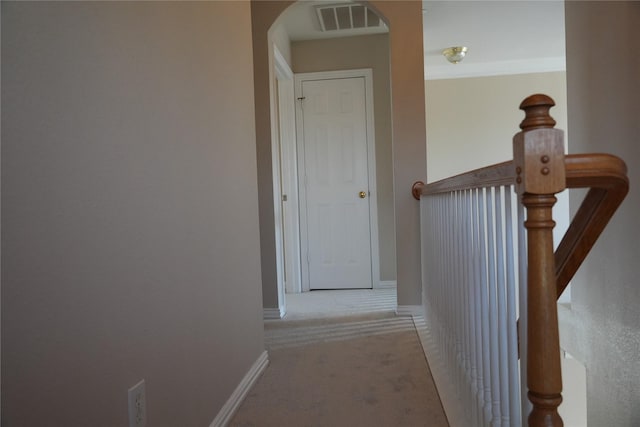8300 Charleston St, Irving, TX 75063 - hallway with carpet, arched walkways, and baseboards