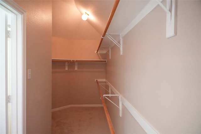 8300 Charleston St, Irving, TX 75063 - spacious closet featuring carpet flooring and lofted ceiling