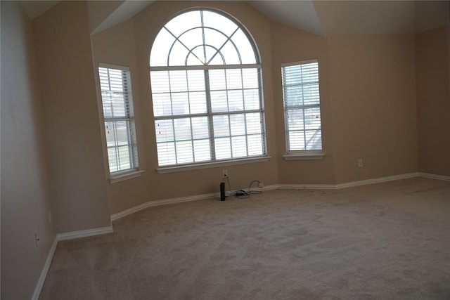 8300 Charleston St, Irving, TX 75063 - unfurnished room featuring carpet, lofted ceiling, and baseboards