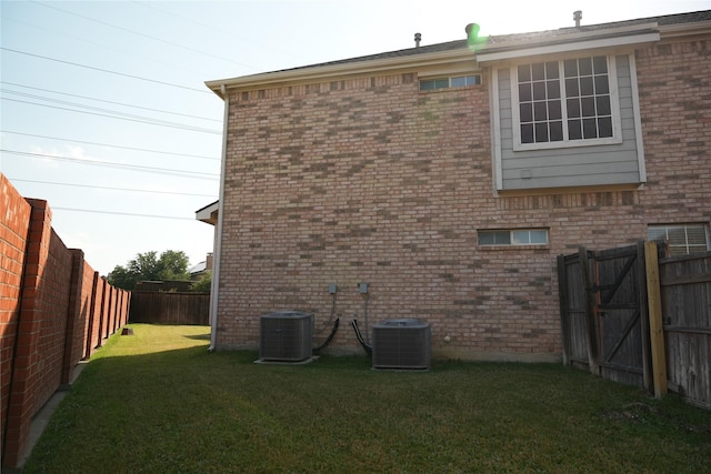 8300 Charleston St, Irving, TX 75063 - view of home's exterior featuring central AC and brick siding