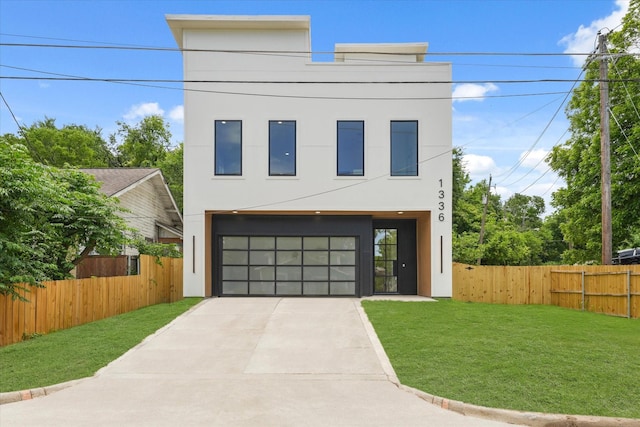 1336 Compton St, Dallas, TX 75203 - contemporary house with stucco siding, concrete driveway, and a garage