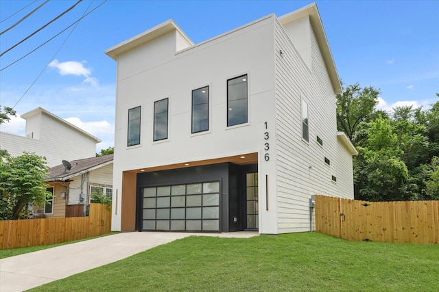 1336 Compton St, Dallas, TX 75203 - modern home with a garage, stucco siding, and concrete driveway