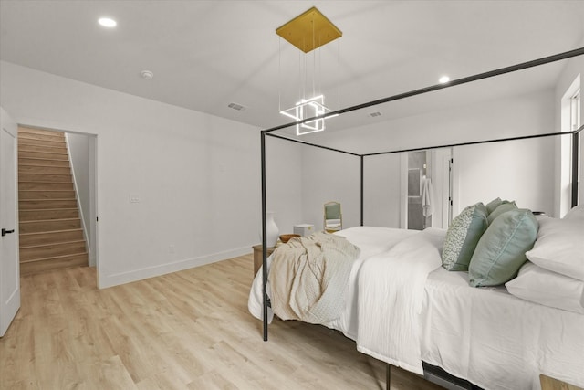 1336 Compton St, Dallas, TX 75203 - bedroom featuring light wood finished floors, recessed lighting, baseboards, and a chandelier