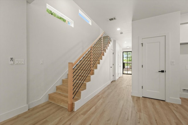 1336 Compton St, Dallas, TX 75203 - stairway featuring wood finished floors, baseboards, and recessed lighting