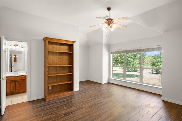 10208 W Rancho Diego Ln, Fort Worth, TX 76036 - empty room featuring dark wood-style flooring, baseboards, ceiling fan, and lofted ceiling
