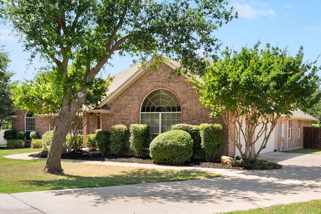 10208 W Rancho Diego Ln, Fort Worth, TX 76036 - view of front of property with brick siding, concrete driveway, and a garage