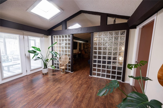 4458 Cardiff Ave, Fort Worth, TX 76133 - spare room with lofted ceiling, wood finished floors, and a textured ceiling