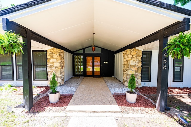 4458 Cardiff Ave, Fort Worth, TX 76133 - doorway to property featuring stone siding, french doors, and covered porch