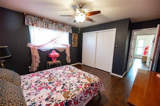 4458 Cardiff Ave, Fort Worth, TX 76133 - bedroom featuring wood finished floors, a closet, baseboards, and a ceiling fan