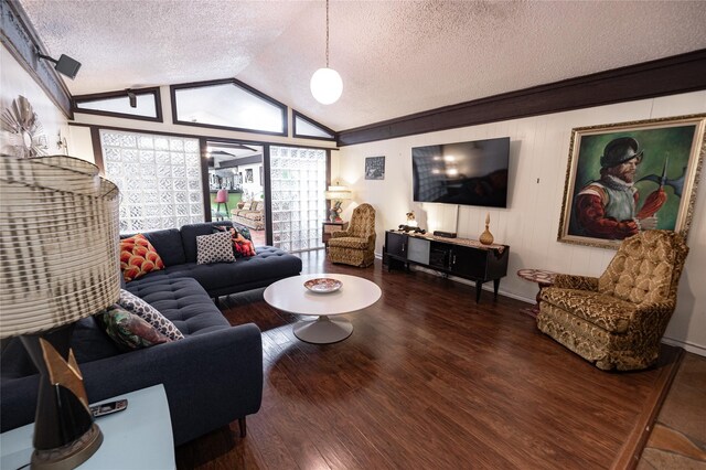 4458 Cardiff Ave, Fort Worth, TX 76133 - living room featuring lofted ceiling, a textured ceiling, wood finished floors, and baseboards