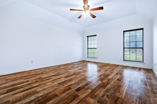 5282 Homeplace Ln, Kaufman, TX 75142 - empty room featuring wood finished floors, ceiling fan, baseboards, and vaulted ceiling