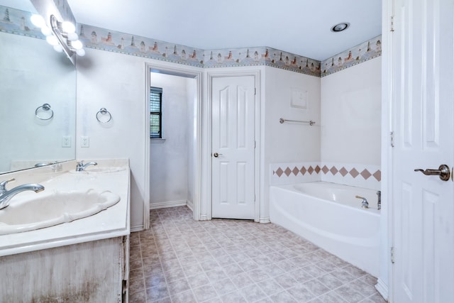 5282 Homeplace Ln, Kaufman, TX 75142 - full bathroom with double vanity, a garden tub, and baseboards