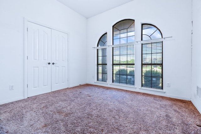 5282 Homeplace Ln, Kaufman, TX 75142 - unfurnished bedroom featuring carpet flooring, a closet, and baseboards