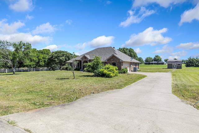 5282 Homeplace Ln, Kaufman, TX 75142 - view of home's exterior with driveway, an attached garage, central AC unit, and roof with shingles