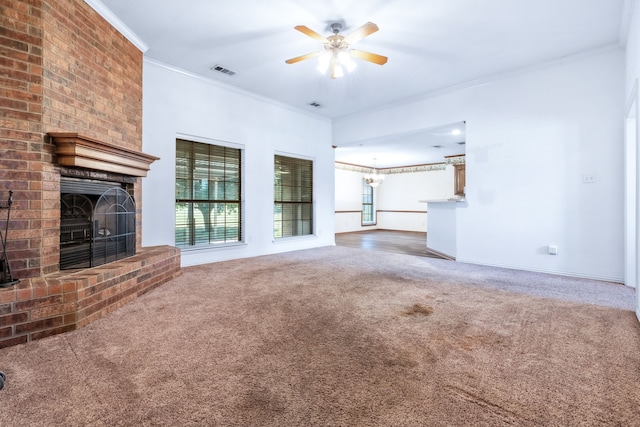 5282 Homeplace Ln, Kaufman, TX 75142 - unfurnished living room with carpet floors, a fireplace, crown molding, a ceiling fan, and a chandelier