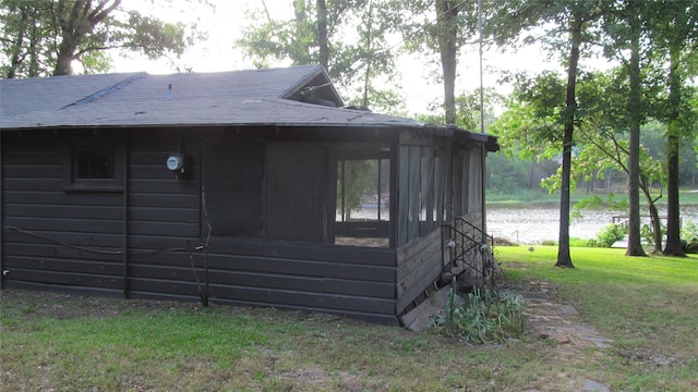 150 County Road 1699, Alba, TX 75410 - view of property exterior with a sunroom, a yard, and roof with shingles