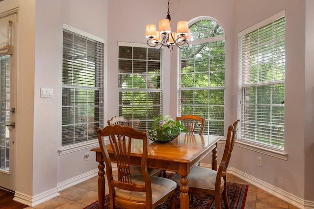 1869 Rio Blanco Dr, Frisco, TX 75033 - dining space with a chandelier, tile patterned flooring, and baseboards