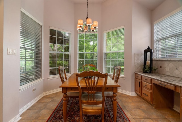 1869 Rio Blanco Dr, Frisco, TX 75033 - dining room featuring plenty of natural light, a chandelier, light tile patterned floors, baseboards, and a high ceiling
