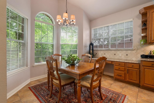 1869 Rio Blanco Dr, Frisco, TX 75033 - dining space featuring light tile patterned flooring, lofted ceiling, and a chandelier