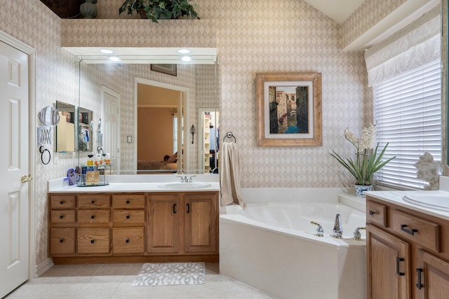 1869 Rio Blanco Dr, Frisco, TX 75033 - bathroom featuring wallpapered walls, vanity, a bath, and tile patterned flooring