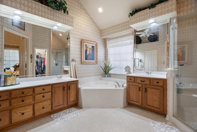 1869 Rio Blanco Dr, Frisco, TX 75033 - bathroom featuring wallpapered walls, vaulted ceiling, a stall shower, vanity, and a bath