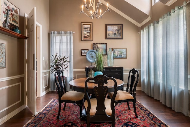 1869 Rio Blanco Dr, Frisco, TX 75033 - dining space with dark wood finished floors, a chandelier, vaulted ceiling, and baseboards