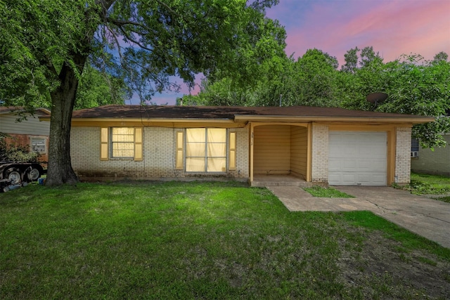 3812 Acree St, Beverly Hills, TX 76711 - ranch-style home with driveway, a front lawn, brick siding, and an attached garage
