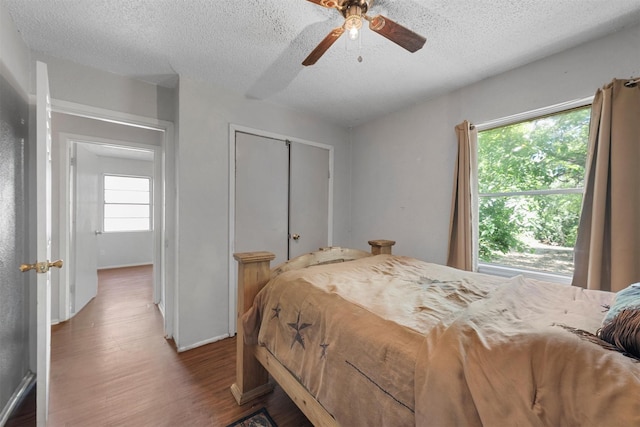 3812 Acree St, Beverly Hills, TX 76711 - bedroom with a textured ceiling, wood finished floors, a closet, and ceiling fan