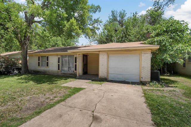 3812 Acree St, Beverly Hills, TX 76711 - single story home featuring brick siding, a front lawn, an attached garage, concrete driveway, and cooling unit