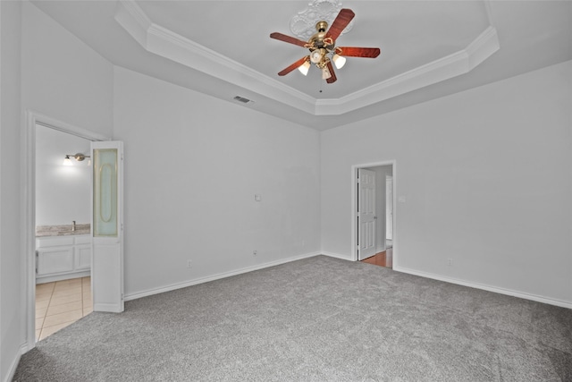 12020 Younger Ct, Azle, TX 76020 - unfurnished room featuring light colored carpet, a raised ceiling, a ceiling fan, crown molding, and baseboards