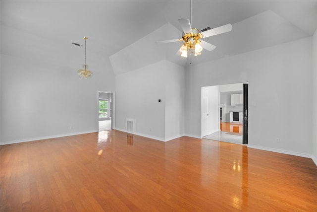 12020 Younger Ct, Azle, TX 76020 - unfurnished living room with high vaulted ceiling, a ceiling fan, light wood finished floors, and baseboards