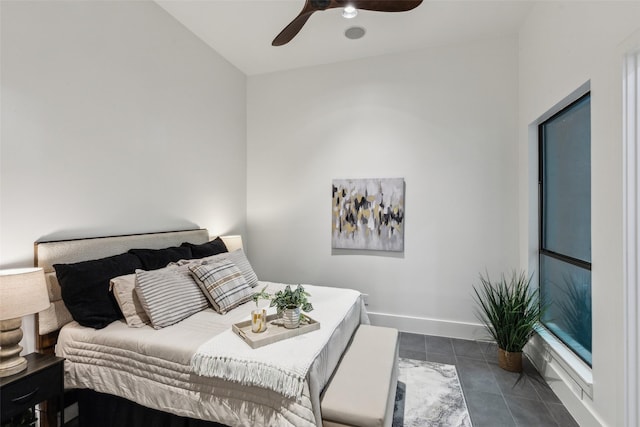 6617 Shady Creek Cir, Plano, TX 75024 - bedroom featuring dark tile patterned flooring, ceiling fan, and baseboards