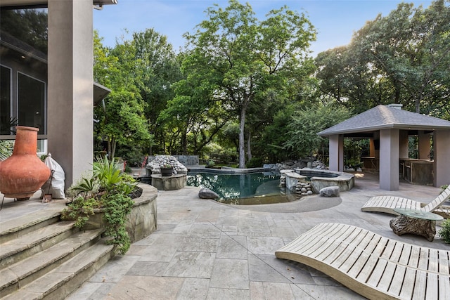 6617 Shady Creek Cir, Plano, TX 75024 - view of patio / terrace with a gazebo, a pool with connected hot tub, and view of scattered trees