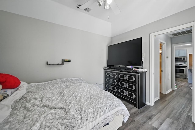 2701 Mims St, Fort Worth, TX 76112 - bedroom featuring wood finished floors, a ceiling fan, and baseboards