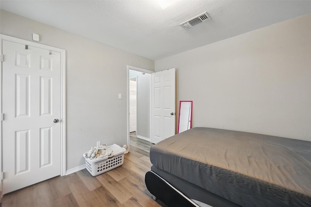 2701 Mims St, Fort Worth, TX 76112 - bedroom featuring wood finished floors and baseboards