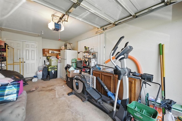 2701 Mims St, Fort Worth, TX 76112 - garage with freestanding refrigerator and a garage door opener
